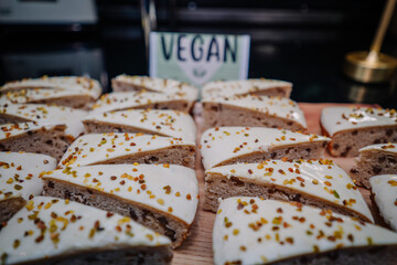 tasty cake on coffee shop , cake in order for sale in restaurant. Vegan cakes. Soft focus.
