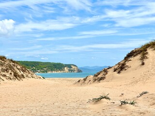 beach access near Faro de Trafalgar with a view to Cala del Varadero and cliffs and mountains...
