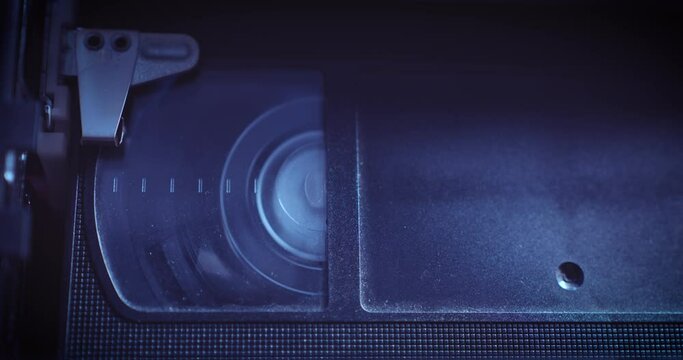 Old VHS Cassette Tape Playing in VCR - Close Up