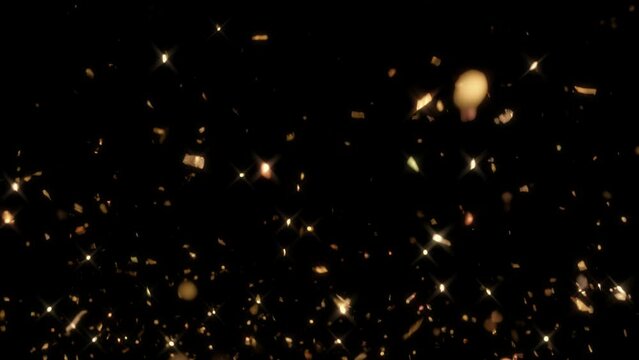 Golden festive Christmas Glitter Snow. Confetti tinsel lametta falling on black background includes premultiplied mask. Overlay and effects dissolve for X-Mas Holiday and luxurious wedding celebration