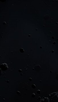Asteroid belt field in dark outer space. 3D animation wide pan shot. Rock formations of cosmic debris and giant Meteorites. Celestial objects on starry stars background with dust nebula haze low light