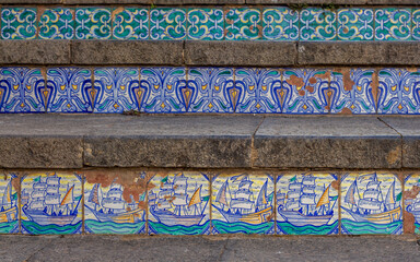 Santa Maria del Monte stairs in Caltagirone, Sicily with handmade ceramic tiles with figurative and geometric motifs, close up, texture, bakground, wallpaper, graffiti.