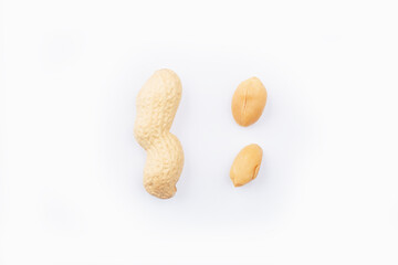 Peanuts on a white background. Groundnuts shelled and in nutshell. Dried peanuts in closeup. set of...