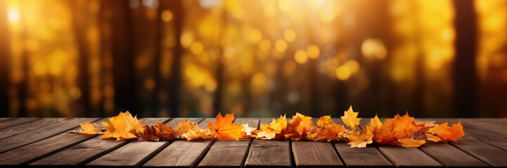 Naklejka na ściany i meble Autumn Maple Leaves on Wooden Table with Warm Backlight