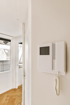 Telephone on white wall at home