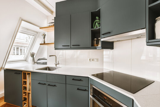 Modern kitchen with cabinets and induction on counter