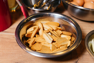 Large steel bowl with gingerbread cookies.