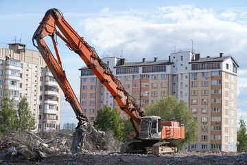 Building house destruction, demolition site excavator with hydraulic crusher machine ruin house