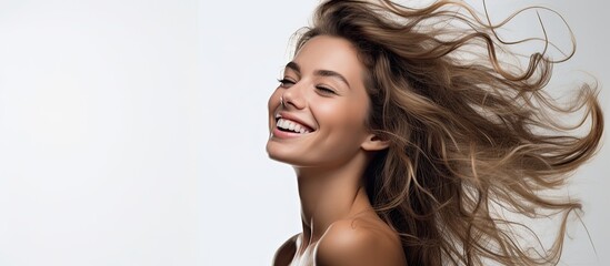 The young woman, with a happy smile on her beautiful face, poses against a white background, exuding confidence and radiating beauty, captivating people with her fashionable style and stunning hair, a