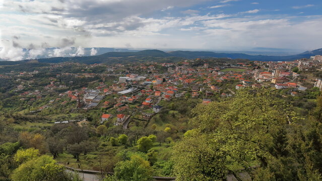 Partial panorama of the southern side of the town under a partly cloudy sky with wisps of fog. Kruje-Albania-050