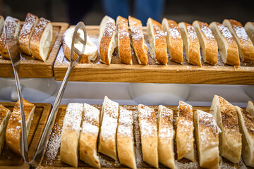 Slices of apple strudel on display in a bakery