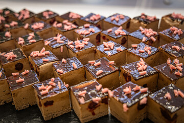 Delicious chocolate cakes on display in a pastry shop. Selective focus.