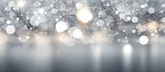 The abstract white background showcases an intricate pattern of gray bokeh lights.