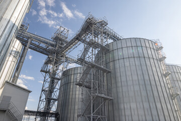 Modern industrial grain Elevator for grain storage. Steel silos for storing grain on a agricultural...