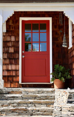 Fototapeta premium Vintage cedar cottage with red Dutch door