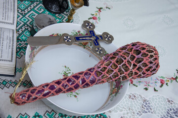 basil  and cross used by priests to sanctify houses with aghiasma and objects in Romania, Bistrita...