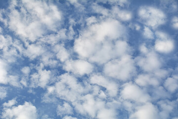 Puffy white clouds blue sky