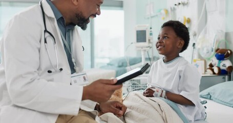Doctor, African boy child and hospital with tablet, smile or rest for recovery from surgery, consulting or inspection. Kid, happy and medic for check, touchscreen or talk in clinic for rehabilitation - Powered by Adobe