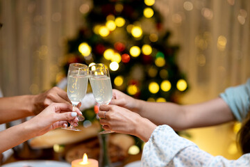 group of 4 friends are toasting cheer at a home party
