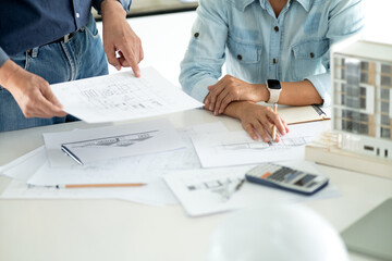 Architect  or engineer is looking at and checking the details of the building
