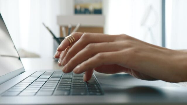 Business people lifestyle 4K. Close up dolly shot of young businesswoman hands typing on keyboard. Busy female working on laptop or computer keyboard fast typing email message, surfing on web browser