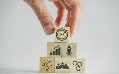 Goal concept in business management and business planning on wooden blocks