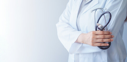 Close up of doctor holding medical stethoscope with blank space white background. Copy space.