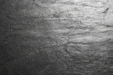 Naklejka premium Texture of grey stone surface as background, closeup