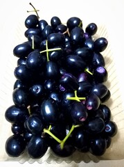 Jambolan plum or Java plum or Duwet fruit or Juwet fruit has sweet astringent taste, usually eaten with salt
