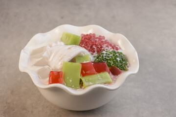 Buko Salad is Filipino Variation of Fruits Salad, it is Usually made from mixed  Sliced Young Coconut, Tapioca Pearl, Jelly, Nata de Coco with Sweetened Milk or Cream.