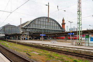 A bustling morning scene at Bremen Central Railway Station with passengers and commuters waiting on...