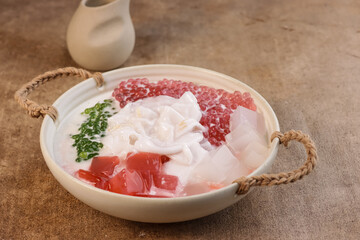 Buko Salad is Filipino Variation of Fruits Salad, it is Usually made from mixed  Sliced Young Coconut, Tapioca Pearl, Jelly, Nata de Coco with Sweetened Milk or Cream.