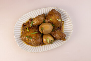 Chicken Adobo with Eggs is a Filipino Dish Stew in Soy Sauce.