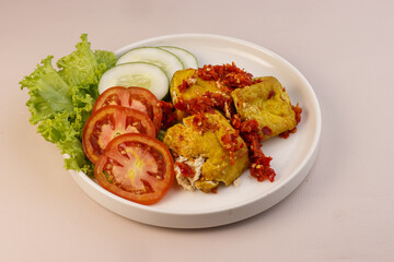 Tahu Penyet is Indonesian Street Food. Fried Tahu or Tofu Smashing in Chili Sauce or Sambal.