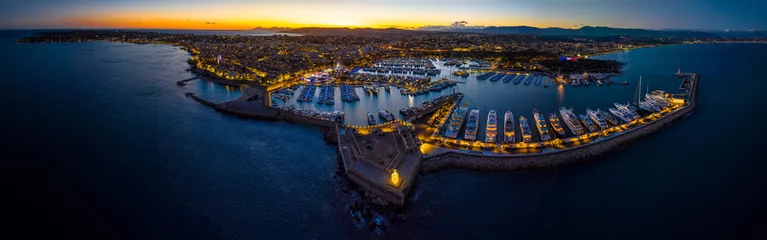Fotobehang Sunset view of Antibes, a resort town between Cannes and Nice on the French Riviera © alexey_fedoren
