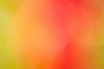 Natural bright defocus light background. Abstract defocused natural background orange red and green.