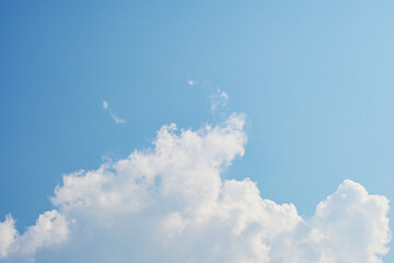 beautiful blue sky and white fluffy cloud with sunrise in the morning, natural background