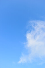beautiful blue sky and white fluffy group of clouds with sunrise in the morning, natural background