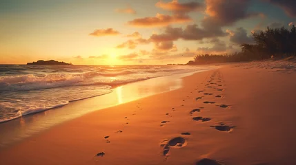 Zelfklevend Fotobehang Footprints in the sand on the beach at sunset © Boraryn
