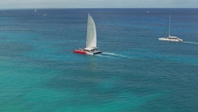 A sailboat in the Caribbean Sea with a beautiful view