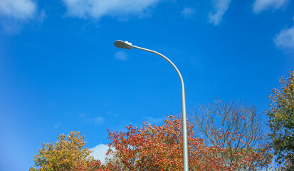 city street with traffic lights illuminating the night, bustling with urban energy and motion blur