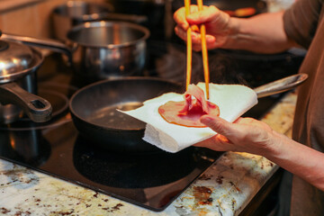 wooden chopsticks resting on a ceramic dish, depicting Asian dining culture and traditional utensils in a minimalistic setting