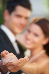 Hands, ring and a couple on their wedding day for love, romance or celebration at a marriage ceremony. Trust, commitment or promise with a bride and groom together at an event to get married closeup