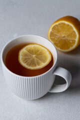 Tea with lemon in a white mug