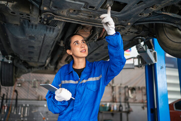 Auto mechanic in blue uniform are repair and maintenance auto engine is problems at car repair...