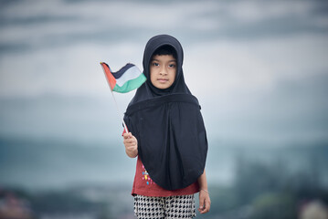 Cute Little girl waving Palestine Flag sends a powerful message of support and empathy to the world 