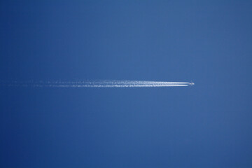 a jet in the blue sky