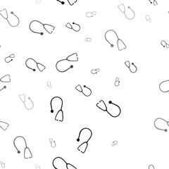 Seamless vector pattern with stethoscope symbols, creating a creative monochrome background with rotated elements. Vector illustration on white background