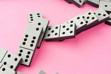 Domino tiles on pink background studio shot
