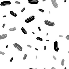 Seamless vector pattern with hotdog symbols, creating a creative monochrome background with rotated elements. Illustration on transparent background